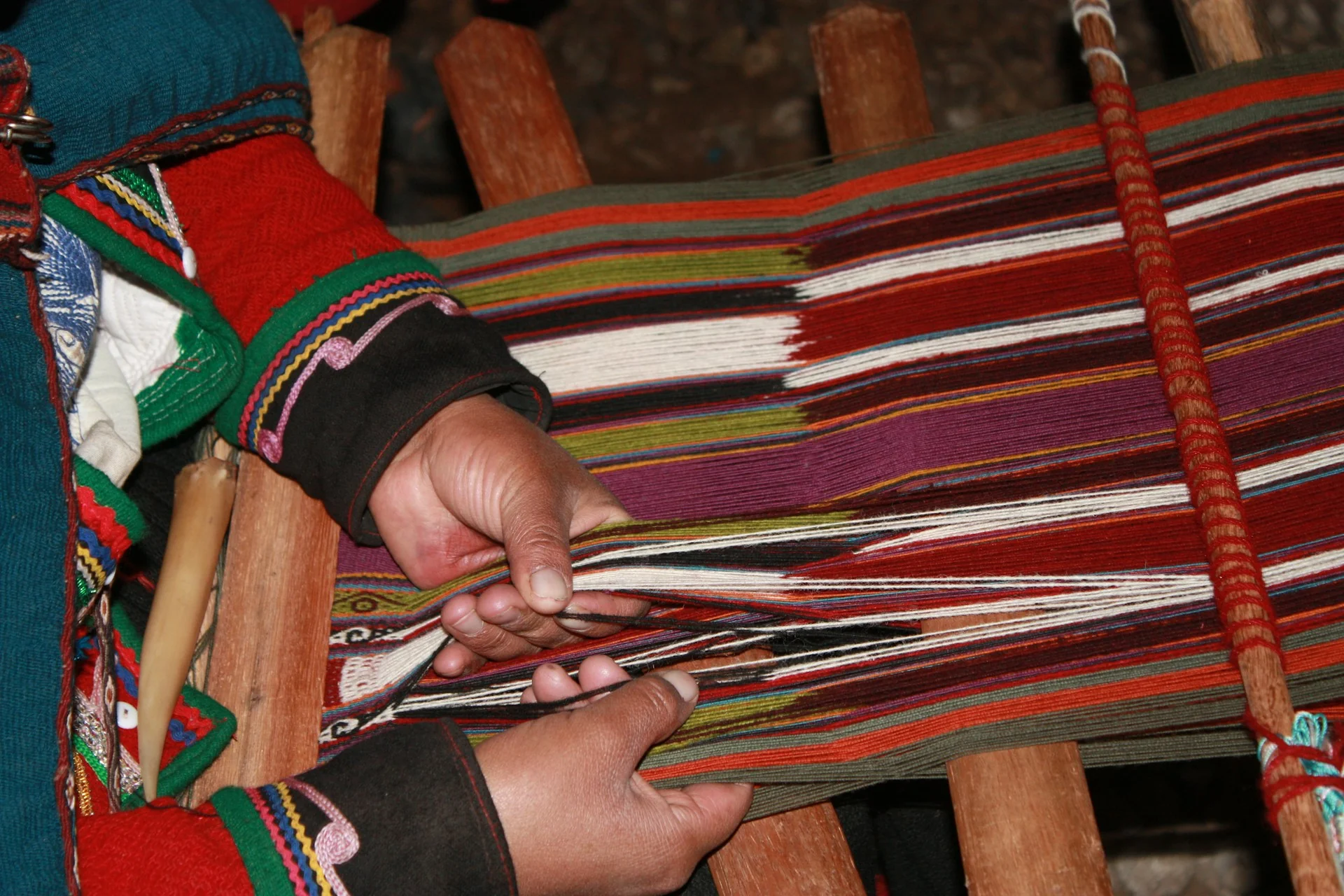Artisan weaving on a traditional loom